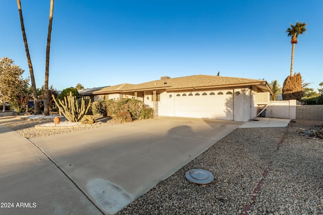 single story home featuring a garage