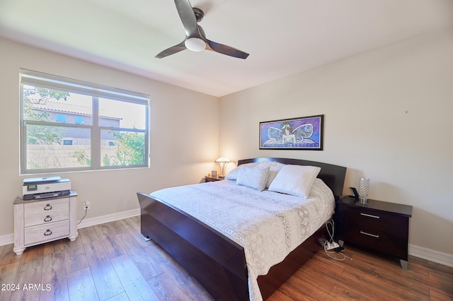 bedroom with ceiling fan and hardwood / wood-style flooring