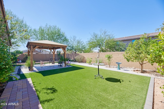 view of yard featuring a gazebo and a patio area