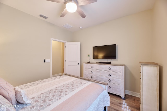 bedroom with hardwood / wood-style flooring and ceiling fan