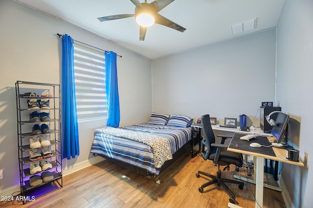 bedroom featuring wood-type flooring and ceiling fan