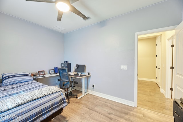 bedroom featuring light hardwood / wood-style flooring and ceiling fan