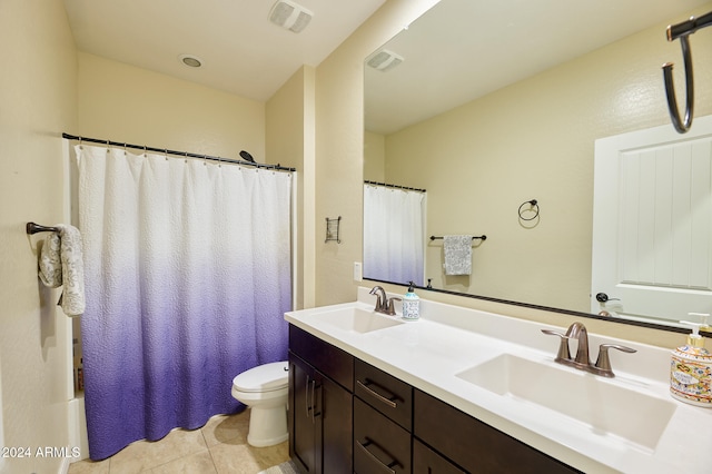 full bathroom with vanity, shower / tub combo, toilet, and tile patterned flooring