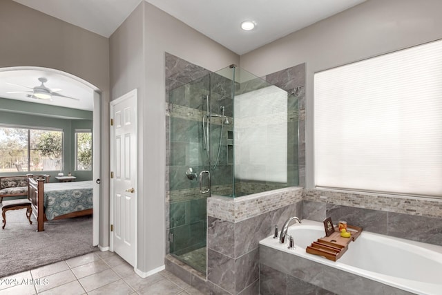 ensuite bathroom with a garden tub, a stall shower, ceiling fan, ensuite bath, and tile patterned floors