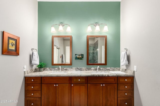 full bathroom with double vanity, a shower with door, and a sink
