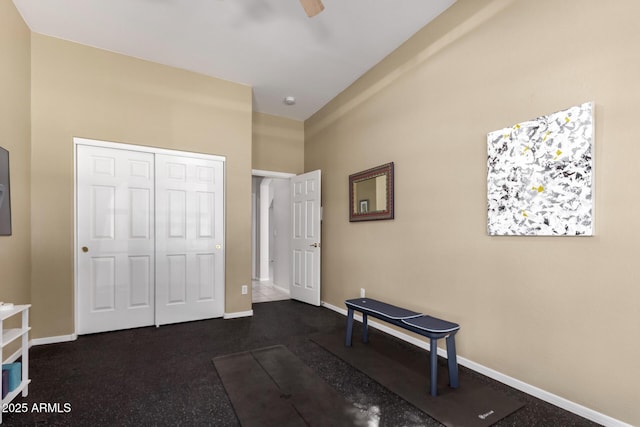 bedroom with a ceiling fan, baseboards, and a closet