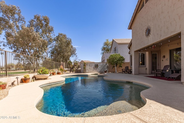 view of pool with a patio, a fenced backyard, and a fenced in pool