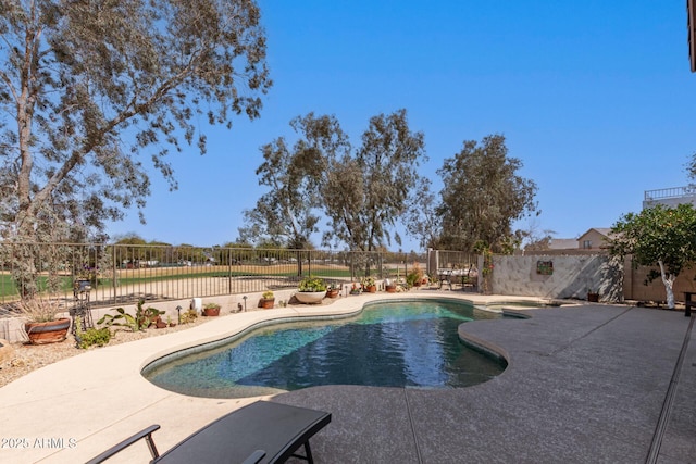 view of swimming pool featuring a fenced backyard, a fenced in pool, and a patio