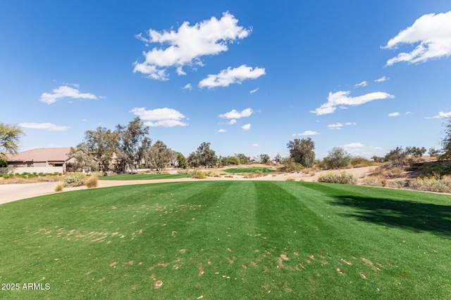view of yard featuring view of golf course