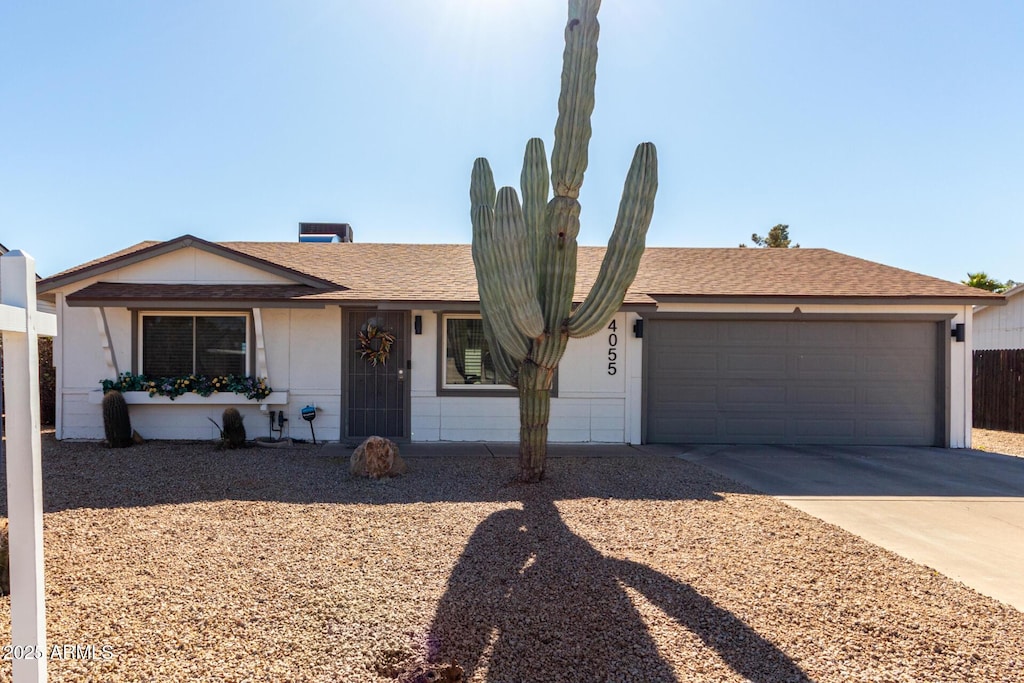 ranch-style home with a garage