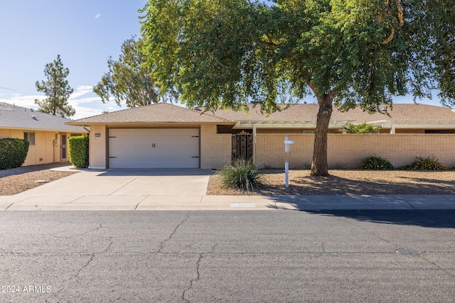 single story home with a garage