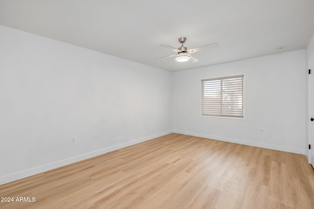 unfurnished room featuring ceiling fan and light wood-type flooring