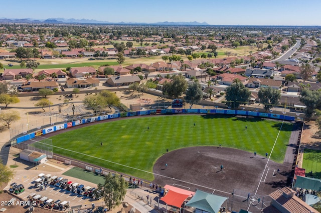 birds eye view of property with a mountain view