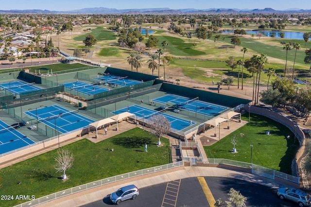 birds eye view of property with a water and mountain view