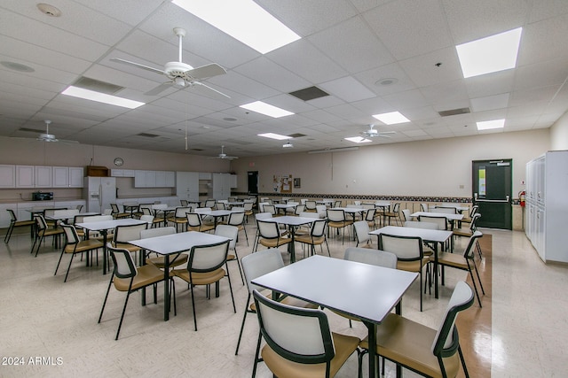 dining room featuring a drop ceiling and ceiling fan