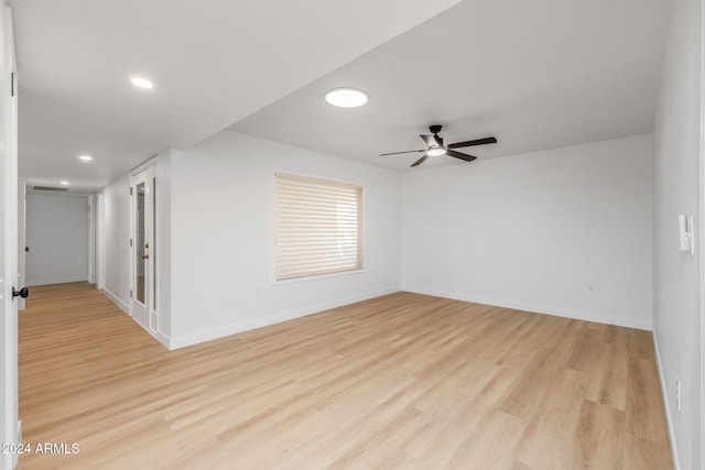 spare room with light hardwood / wood-style flooring and ceiling fan