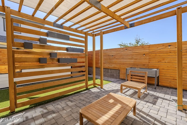 view of patio featuring a pergola