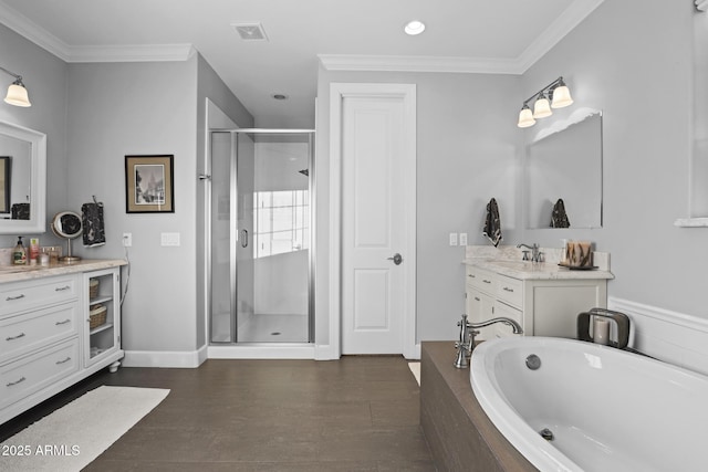 full bath featuring visible vents, ornamental molding, a stall shower, vanity, and wood finished floors