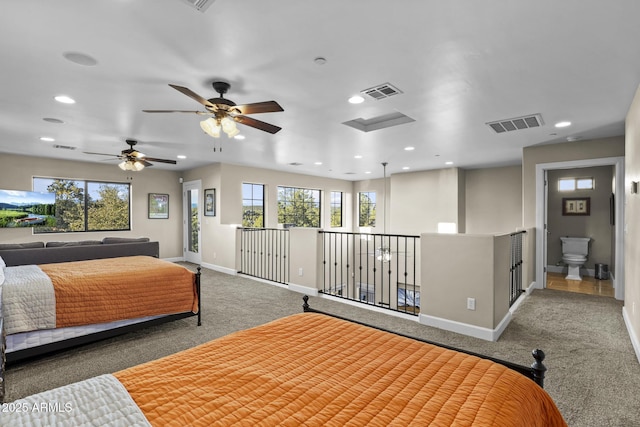 carpeted bedroom with baseboards, multiple windows, and visible vents