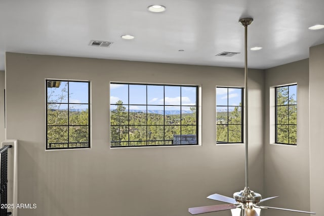 interior details with visible vents, a ceiling fan, and recessed lighting