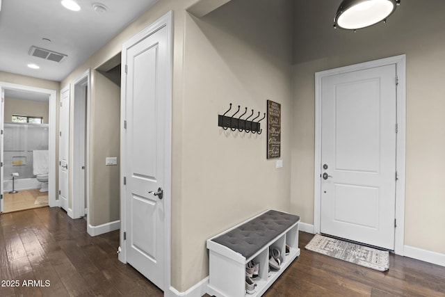 mudroom with recessed lighting, visible vents, dark wood finished floors, and baseboards