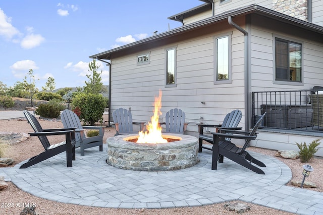 view of patio / terrace with an outdoor fire pit