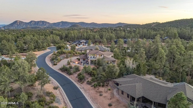 bird's eye view with a mountain view and a wooded view