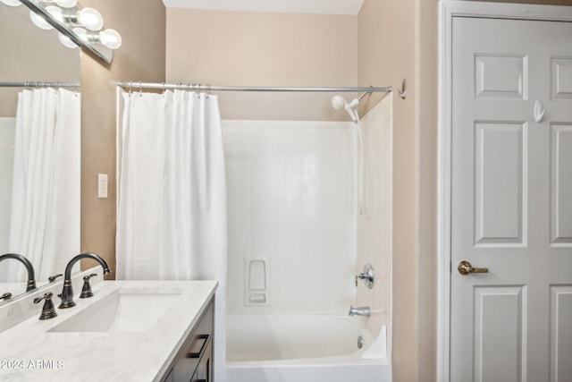 bathroom featuring vanity and shower / bath combo