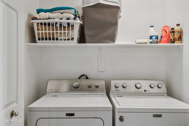 washroom featuring washer and clothes dryer