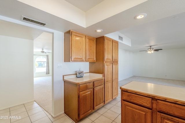 kitchen with light tile patterned floors and ceiling fan