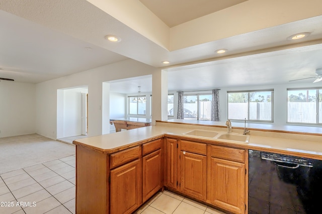 kitchen with light carpet, ceiling fan with notable chandelier, sink, black dishwasher, and kitchen peninsula