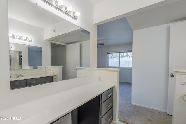 bathroom with ceiling fan and vanity