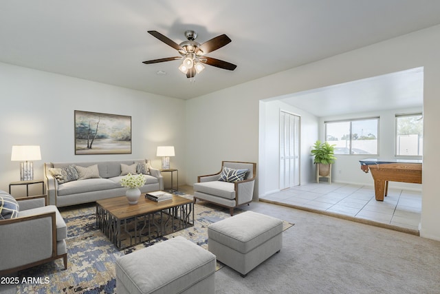 living room with light colored carpet, ceiling fan, and billiards