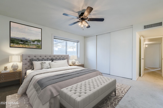 bedroom with carpet flooring, ceiling fan, and a closet