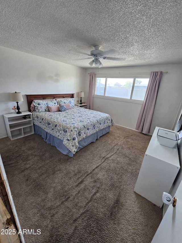 bedroom with carpet, a ceiling fan, and a textured ceiling