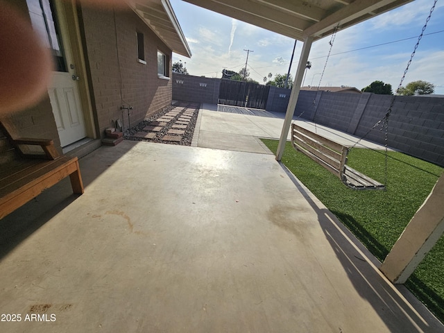 view of patio / terrace featuring fence