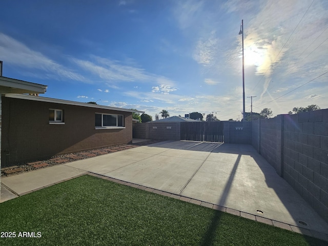 view of patio featuring fence