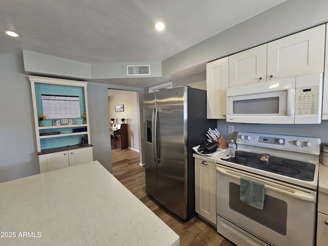 1904 E Jarvis Ave, Mesa, AZ 85204 - kitchen featuring white appliances, dark wood-style flooring, light countertops, white cabinetry, and recessed lighting
