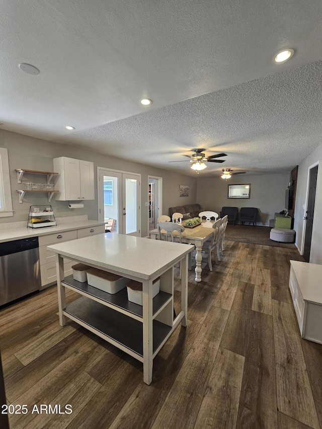 1904 E Jarvis Ave, Mesa, AZ 85204 - kitchen featuring open shelves, dishwasher, open floor plan, light countertops, and a textured ceiling