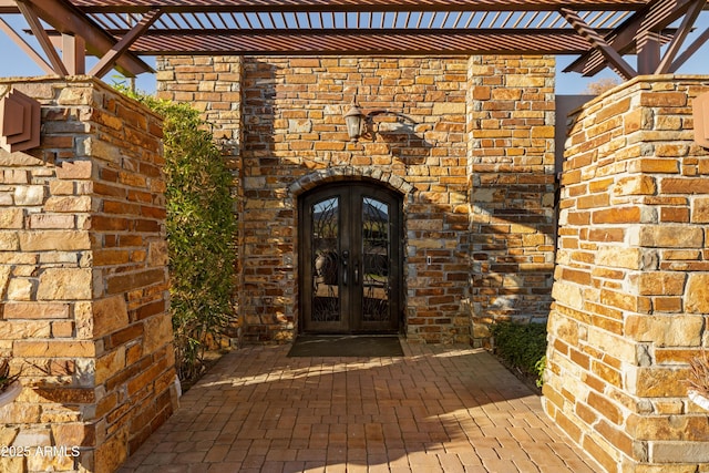 doorway to property with a pergola and french doors