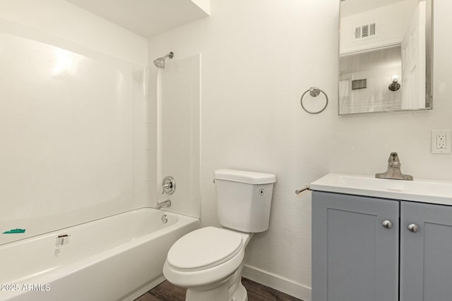 full bath with baseboards, visible vents, toilet, vanity, and shower / washtub combination