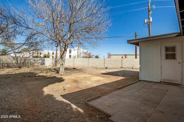 view of yard with a patio and a fenced backyard