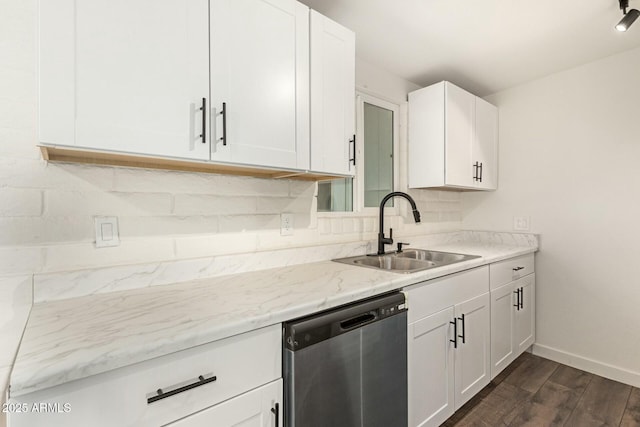 kitchen featuring stainless steel dishwasher, dark wood-type flooring, a sink, and white cabinets