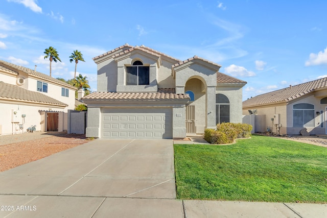 mediterranean / spanish-style house with a garage and a front lawn