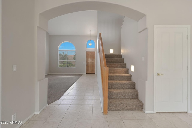 staircase with tile patterned floors