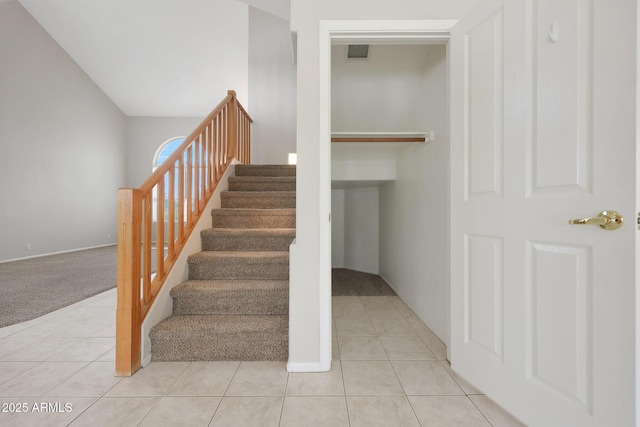 staircase with tile patterned flooring