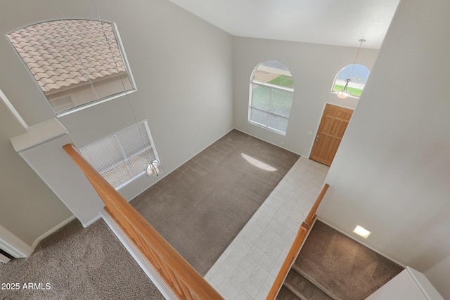 view of carpeted foyer entrance