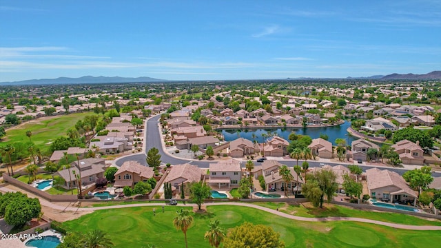 drone / aerial view featuring a water and mountain view