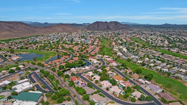 bird's eye view with a water and mountain view