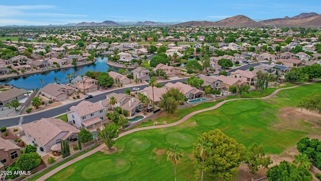 birds eye view of property featuring a water and mountain view